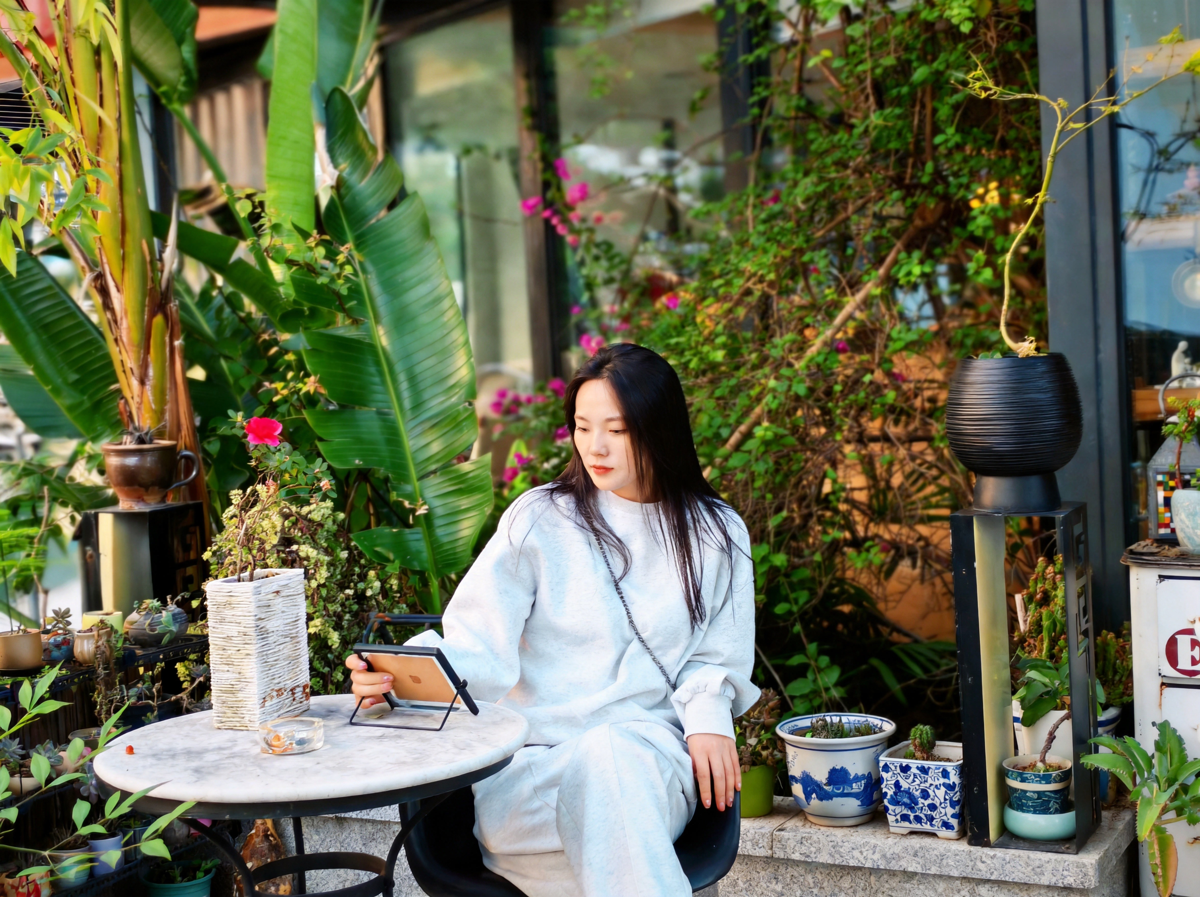 At a garden café with a tablet